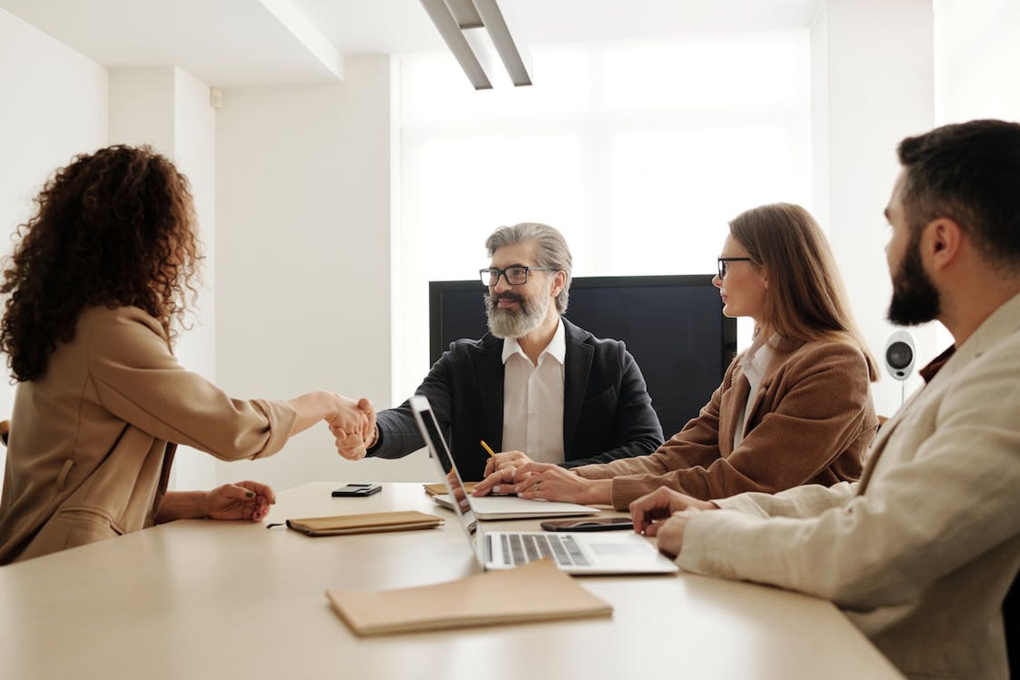  A group of business professionals in a meeting discussing in-demand digital skills in the Australian job market.