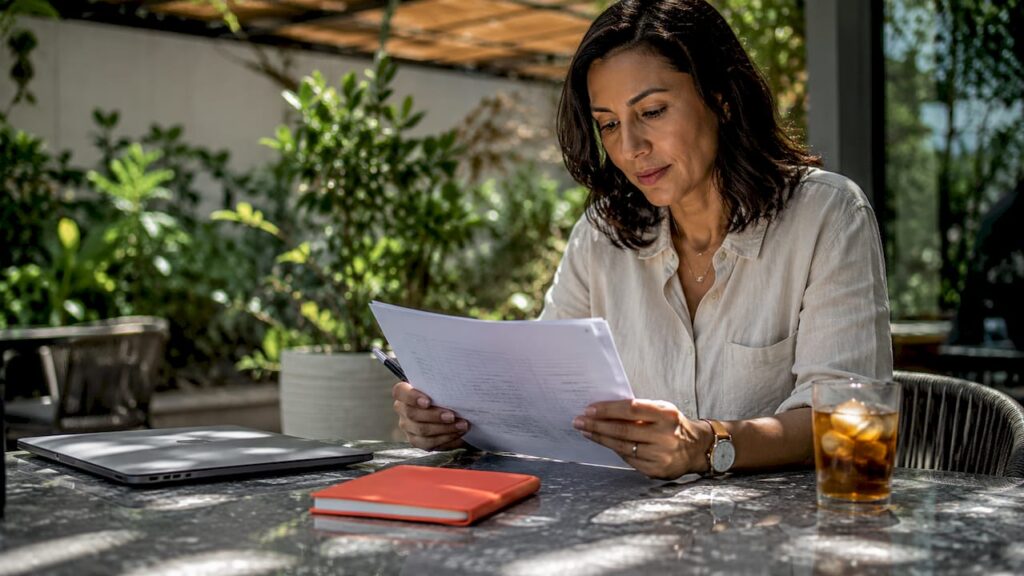 HR manager reviewing interview notes at office desk