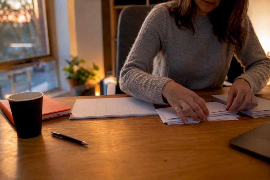 Hands sorting recruitment budget categories