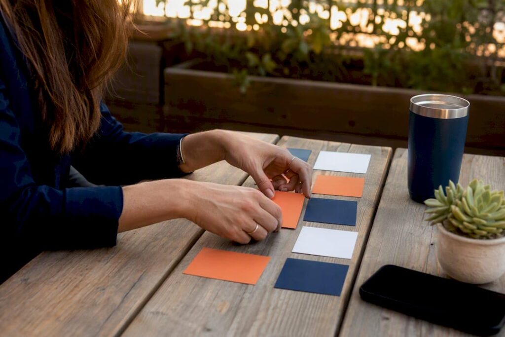 Hands sorting competency cards for skills analysis