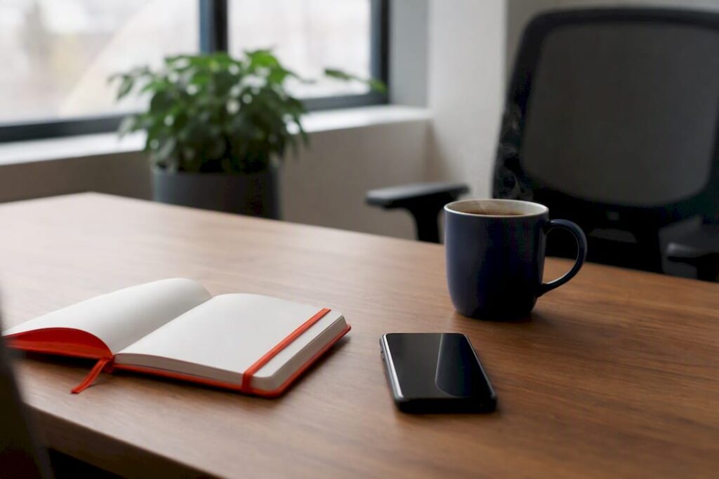 Empty small business office desk with coffee