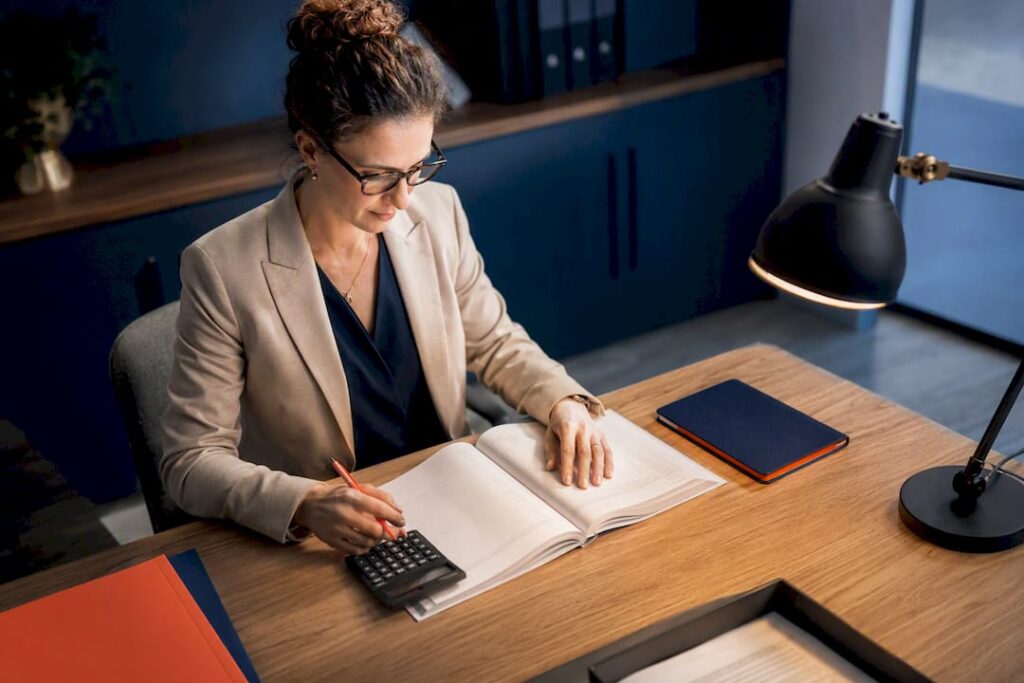 Bookkeeper reconciling small business accounts