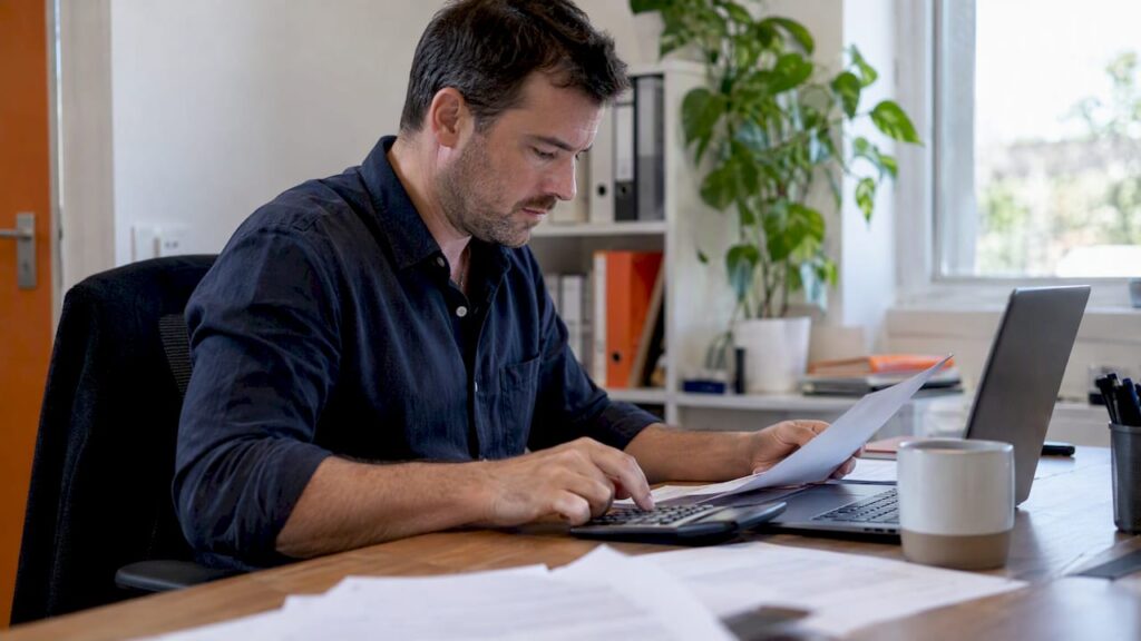 Business owner comparing recruitment fee quotes